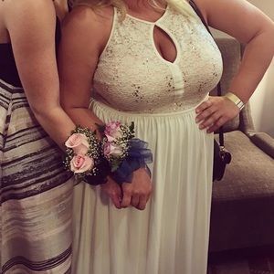 Floor length White gown.